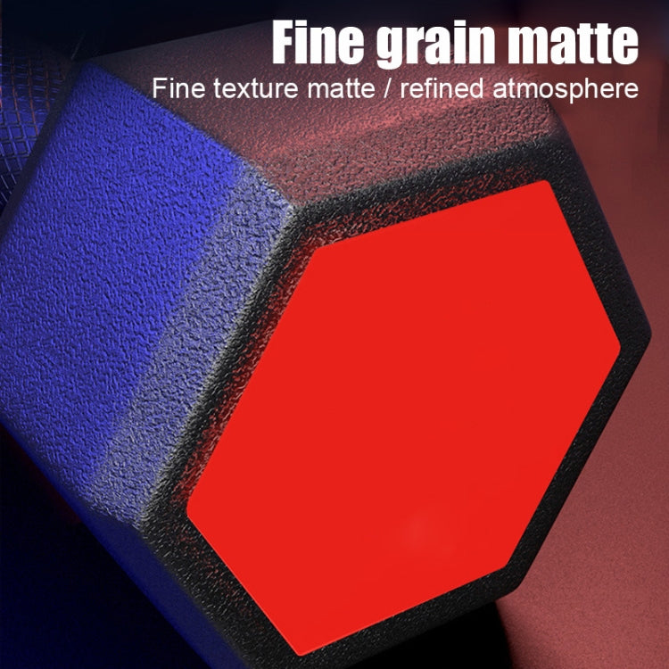 Hex dumbbell end cap with red inset and black textured coating, close-up view