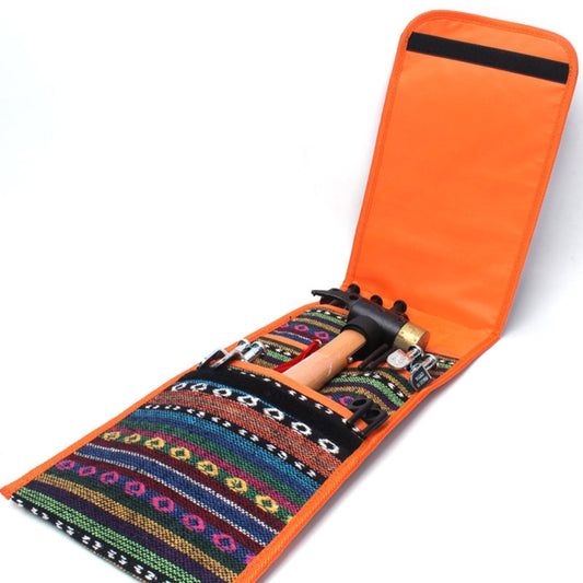 Orange tent peg storage pouch with patterned fabric, hammer, and tent pegs