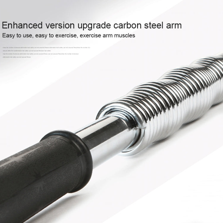 Close-up spring arm strength trainer with silver coil and black rubber handles