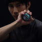 Person holding a YUNMAI wrist gyroball spinner near the face