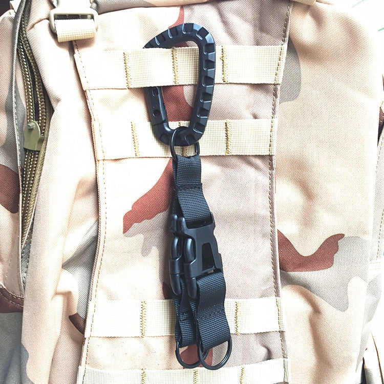 Black tri-glide buckle strap attached to a camo backpack panel