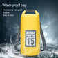 Yellow waterproof dry bag with roll-top closure and dual shoulder straps.