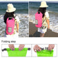 Pink waterproof dry bag with roll-top closure, worn across the shoulder.
