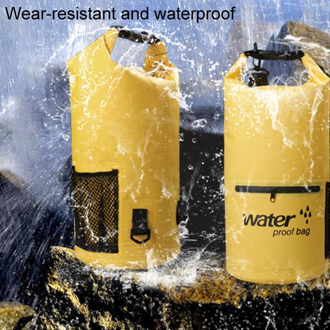 Yellow waterproof dry sack bag with roll-top closure, front zip pocket, and mesh side pouch
