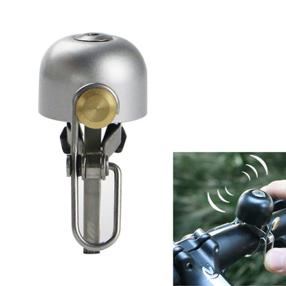 Silver retro bicycle bell with brass button and metal mounting bracket