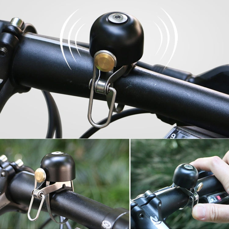 Black retro bicycle bell with metal ring mount on handlebar