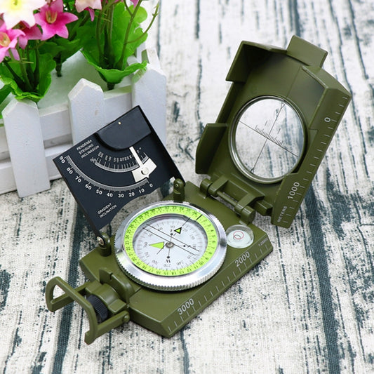 Olive green prismatic compass with magnifier window and rotating sight