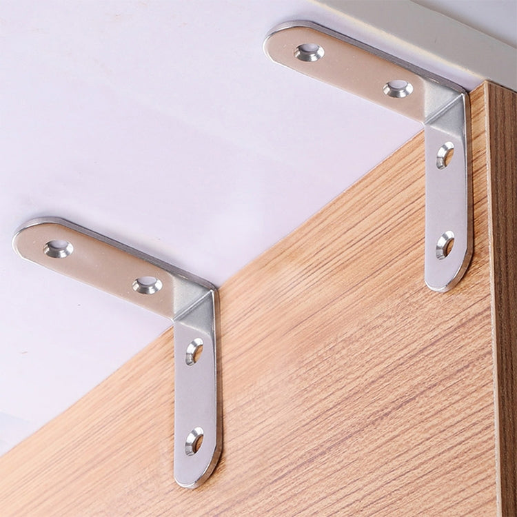 Stainless steel corner brace brackets securing a wooden board at a right angle