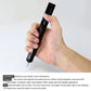 Black solder desoldering pump held in hand with white nozzle tip