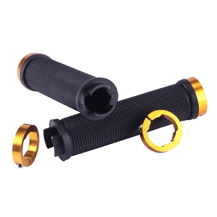 Black textured bike handlebar grips with gold end rings and lock clamps, pair
