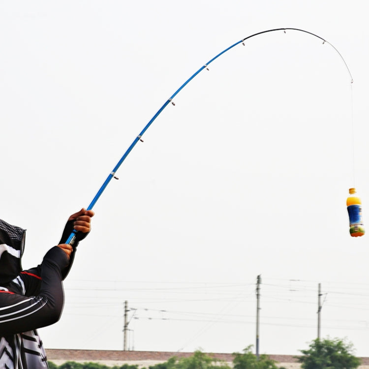Telescopic fishing rod held up with blue line curve during fishing