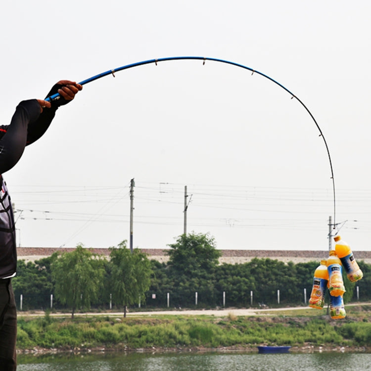 Extended telescopic fishing rod arched with line, hand gripping the handle