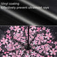 Close-up of black umbrella canopy with pink cherry blossom pattern
