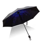 Open black umbrella with blue starry galaxy pattern and black frame