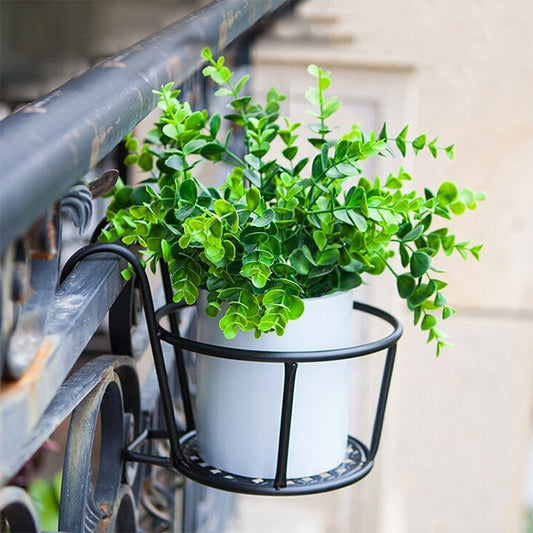 Black metal hanging flowerpot rack with curved handle and two-tier round shelf