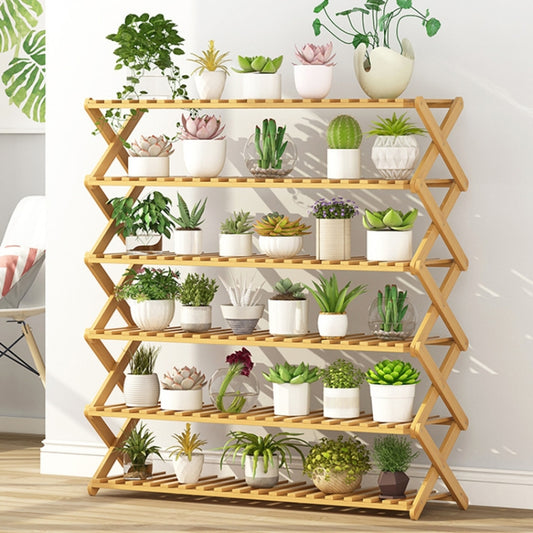 Light bamboo 6-tier plant stand with slatted shelves holding potted plants