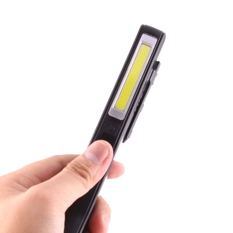 Handheld black COB LED pen light showing vertical light window