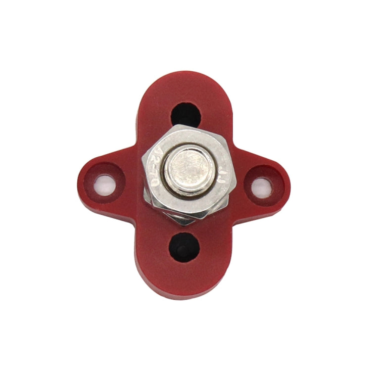 Red cross-shaped terminal block with metal stud and hex nut, two side holes