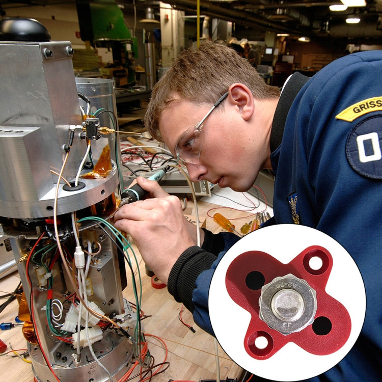 Red terminal stud block shown in an electrical setup, metal stud with mounting screws
