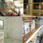 Stainless steel glass railing bracket clamp with black gasket securing clear glass