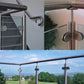 Stainless steel glass railing clamp brackets mounted on metal rail with glass