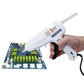 White hot pneumatic glue gun in hand above circuit board; orange nozzle visible
