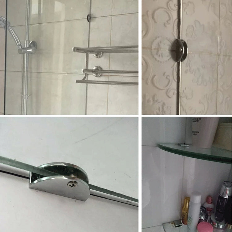Wall-mounted glass clamps with silver brackets holding a glass shelf