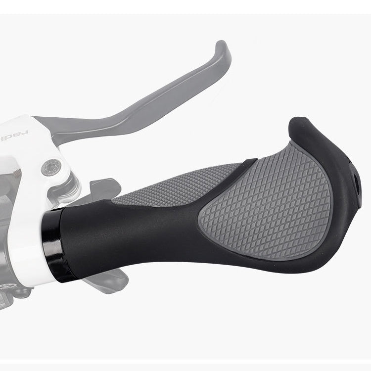 Installed mountain bike handlebar rubber grips with gray textured palm pads