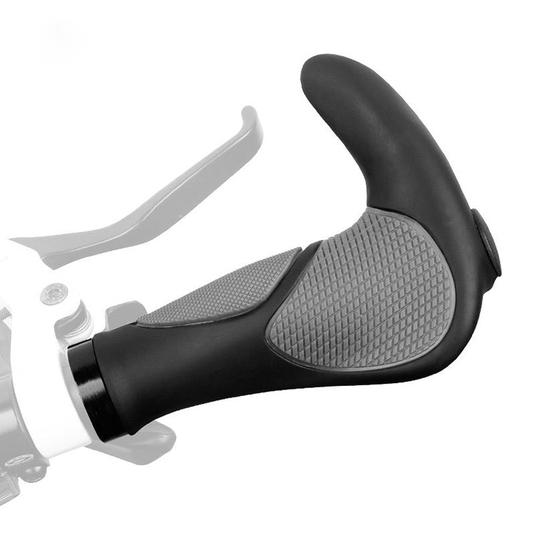 Black handlebar grips with gray textured pads and horn attachment on the left side.