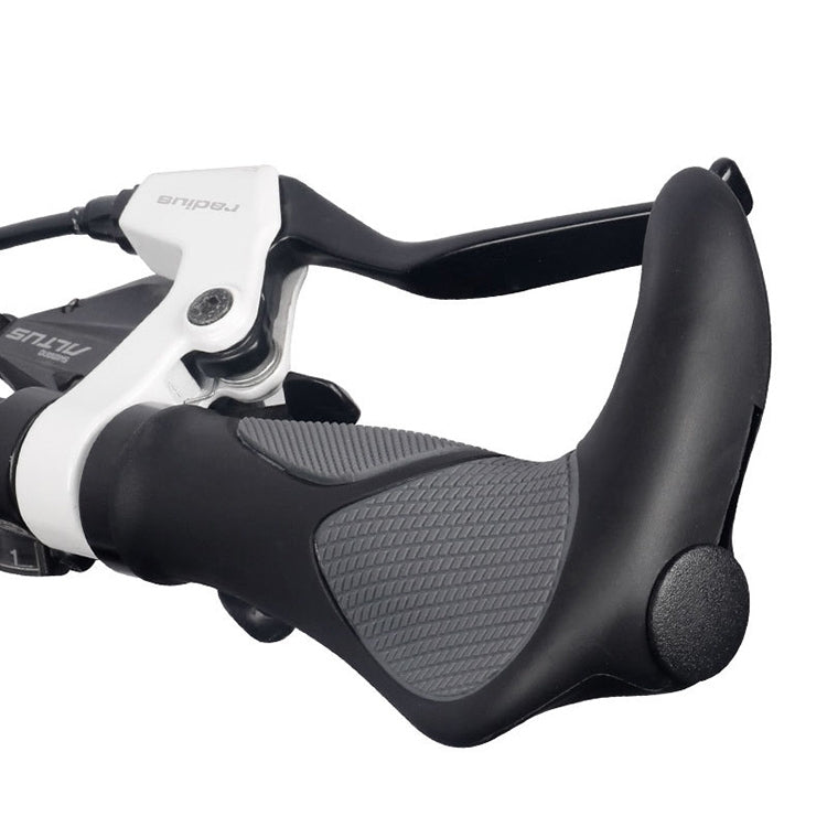 Black rubber grips with gray textured pads and horn handlebar horn mount for bike.