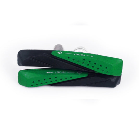 Green and black bicycle brake pads with ventilation holes, side view
