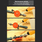 Manual hand drill on wood with orange disc, steel bit, and dark green handle