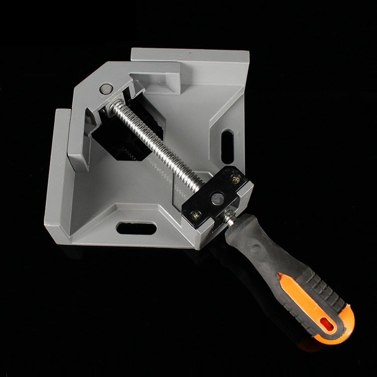 Gray aluminum corner clamp with threaded screw and black-orange handle shown close-up