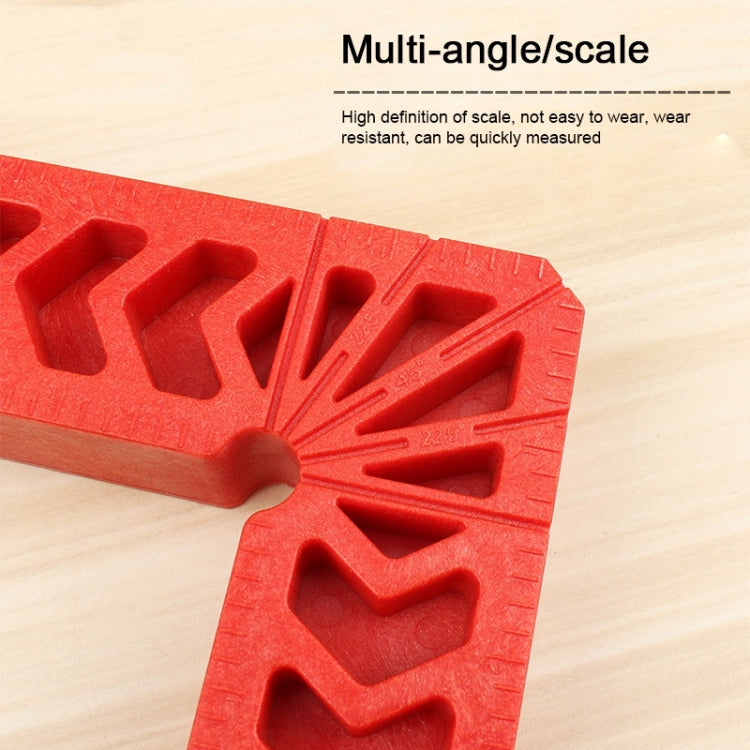 Red plastic 90-degree woodworking positioner square tool with textured scale grooves