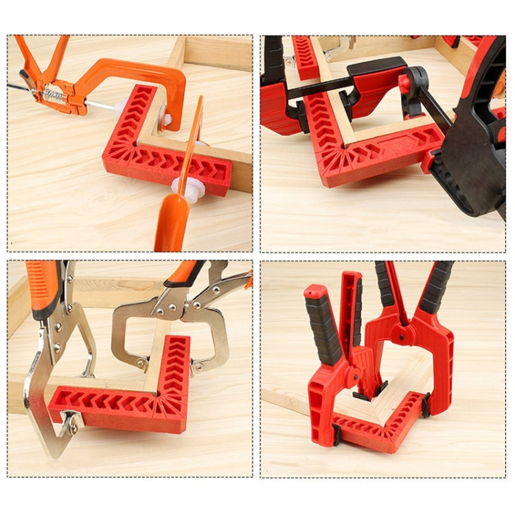 Red plastic 90-degree woodworking positioner square tool used with clamps for alignment