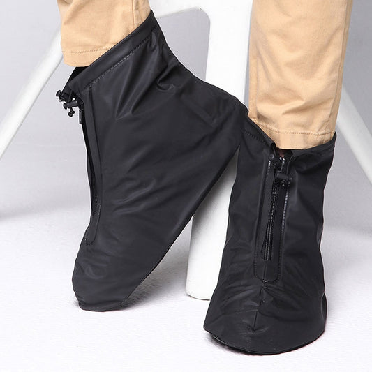 Black waterproof shoe covers with thick sole, ankle height, zip front, non-slip tread