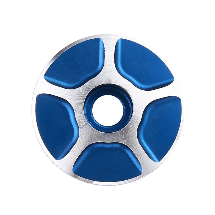 CNC aluminum bike headset cap, silver face with blue inset pads and center hole