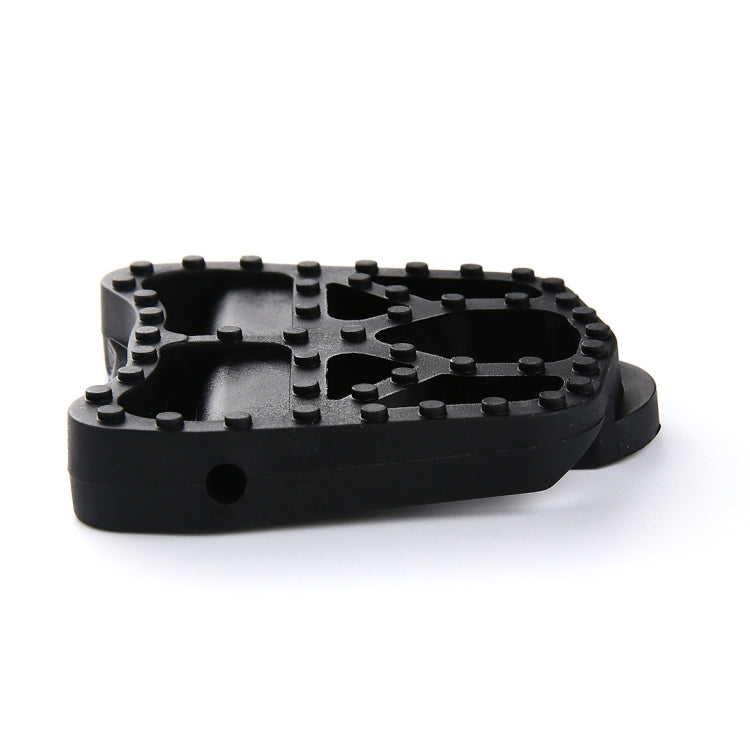 Underside of black KEO-style pedal bases with multiple grip pins