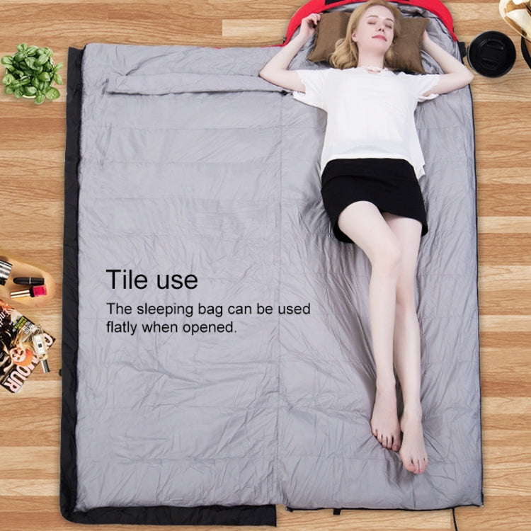 Gray sleeping bag opened flat with dark trim and hood at one end