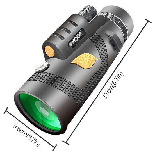 Gray night vision monocular with textured grip and green objective lens, side view
