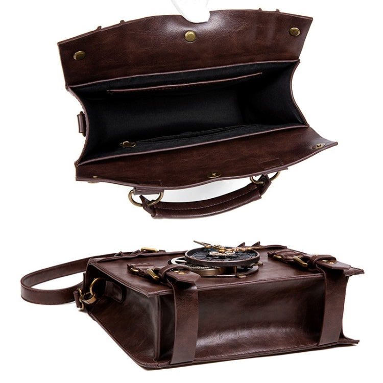 Brown crossbody bag open view showing dark lined interior and gear-strap front details