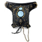 Black waist bag with ornate gold filigree, blue gem front, chain tassel, and loop strap