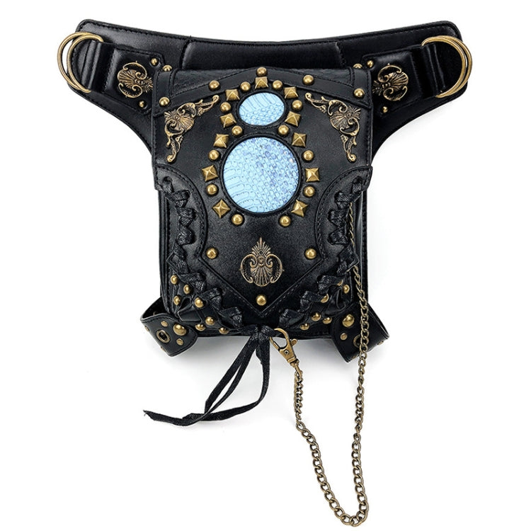 Black waist bag with ornate gold filigree, blue gem front, chain tassel, and loop strap