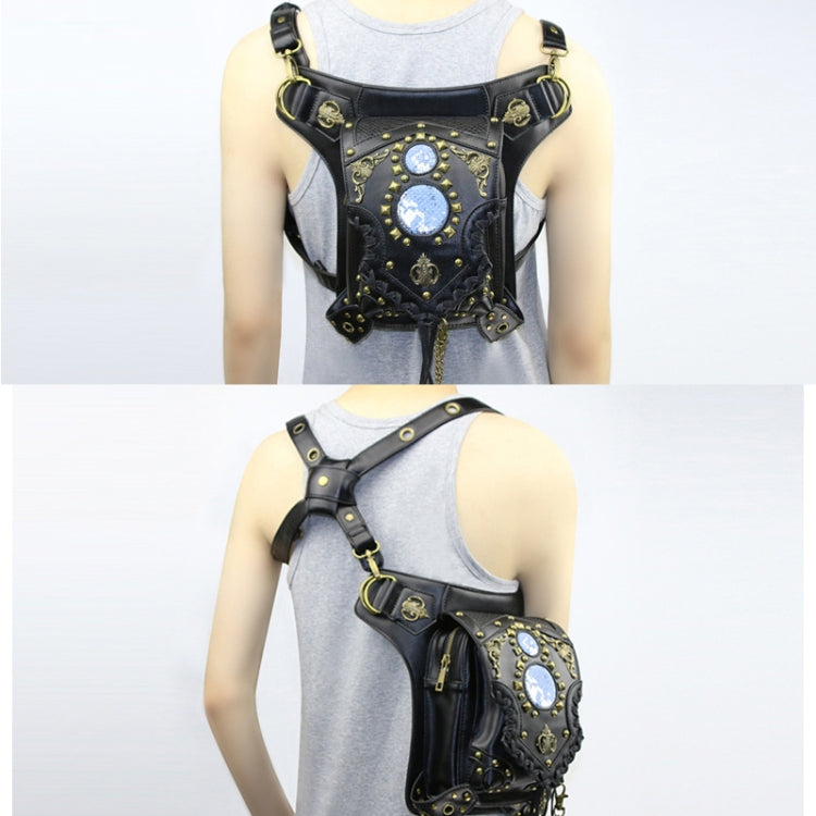 Black one-shoulder bag worn over top with blue gem center panel and adjustable strap