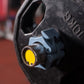Black barbell buckle clamp detail with metal rod holder and yellow ring insert.