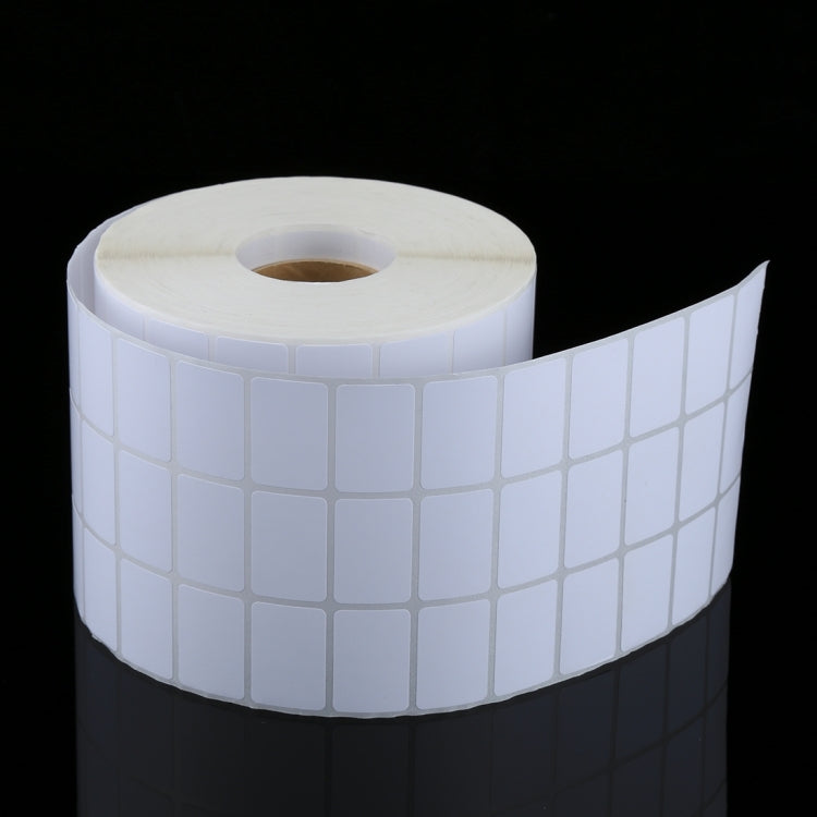 Curved roll of white 20x30 mm label stickers with grid cells