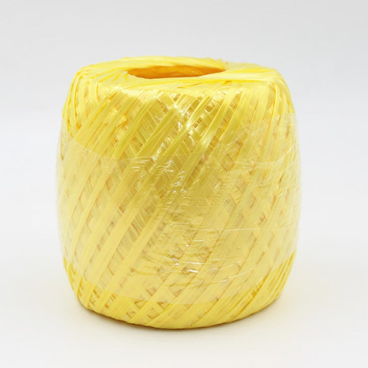 Yellow plastic packing rope spool, tightly wrapped strapping cord roll