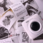 Thermal label printer paper rolls with printed label sheets and a label printer