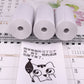 Thermal label printer paper rolls and a cartoon label sheet on a planner