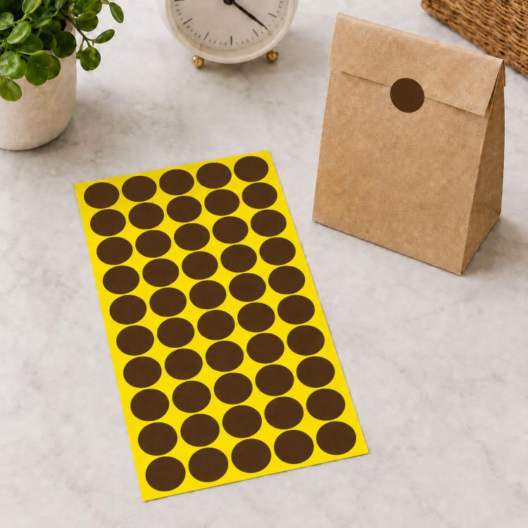 Coffee brown round self-adhesive sticker labels sheet with brown dot circles on yellow backing